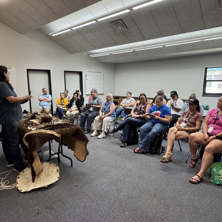 Learning about artifact with Randall Tall Bull